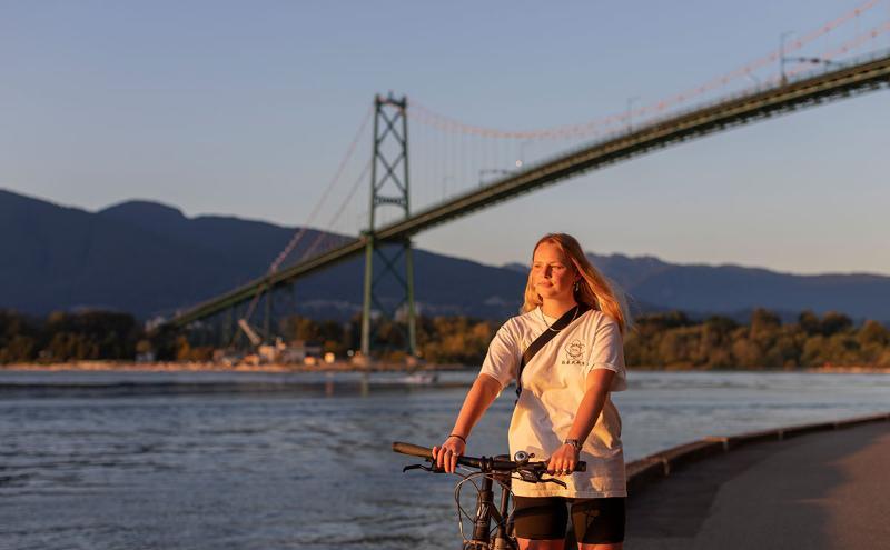 Incoming Exchange photo Student walking bike along Stanley Park SeaWall