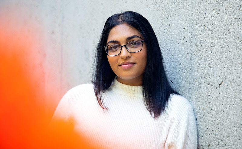 Student leaning against wall