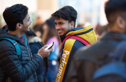 Students smiling at campus event